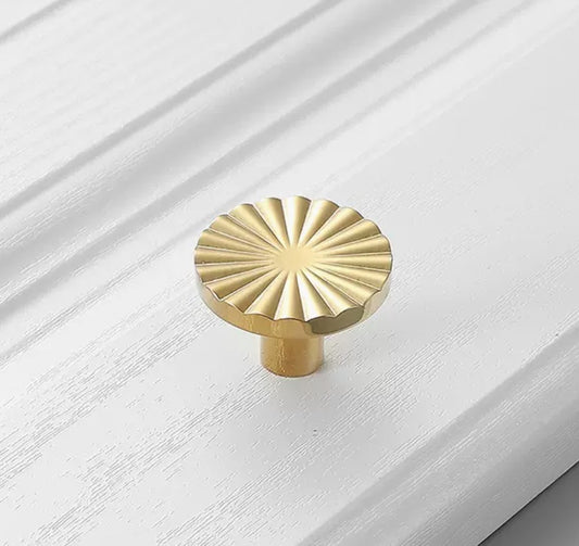 Cabinet knob, round chiselled shape, light gold colour metal, mat finish, 1 piece
