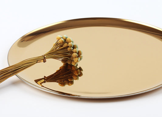 Metallic golden round tray for display and serving, gold colour with shiny finish