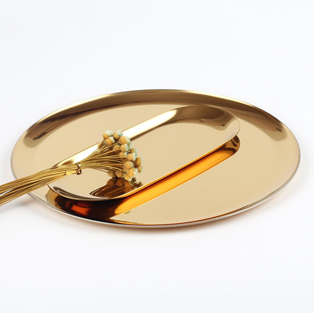 Metallic golden round tray for display and serving, gold colour with shiny finish